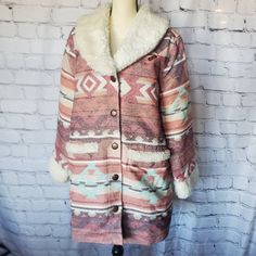 Wrangler Retro Women's Size Large Pink, Maroon, Cream, Light Blue Southwestern Print Cotton Shell With "Quilted" Lining Soft Sherpa Lined Shawl Collar, Cuff, And Pockets Mid-Length Silhouette Pea Coat Lined Hand Warming Pockets At Waist Button Closure In Front This Coat Is So Cozy!!! But Temps In Arkansas Are Rarely Low Enough To Justify My Keeping Such A Beautiful Coat Hidden In My Closet. :( Winter Outerwear With Pockets For Rodeo, Western Winter Outerwear For Ranch, Winter Rodeo Outerwear With Pockets, Wrangler Sherpa Jacket, Western Coats & Jackets, American Indian Clothing Coats & Jackets, Blue Jean Vest, Pink Fleece-lined Outerwear For Winter, Burgundy Vest