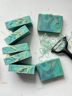 some soaps and scissors on a table