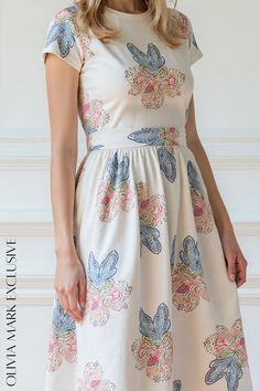 Olivia Mark - Elegant Blooms Midi Dress - Pastel Floral Print Summer Cream Fit And Flare Dress, Summer Fit And Flare Cream Dress, Fitted Cotton Dress For Garden Party, Beige Fitted Waist Dress For Spring, Elegant Multicolor Cotton Midi Dress, Beige Printed Fitted Dress, Beige Fitted Printed Dress, Cotton Fitted Midi Dress For Garden Party, Fitted Beige Printed Dress