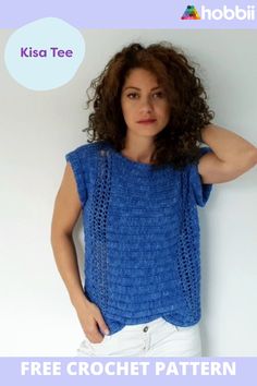 a woman is wearing a blue top with crochet on the front and bottom