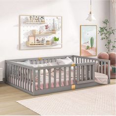 a baby's room with two cribs in it