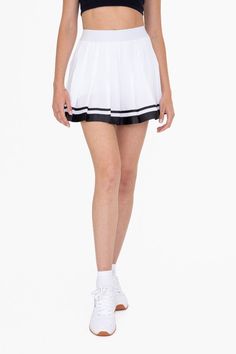 This Pleated Tennis Skirt is crafted for style and comfort. It features a high-end grosgrain ribbon trim and built-in undershorts with pockets for extra coverage. Enjoy the perfect pleats and added convenience for your next match. Fabric & fit: 100% recycled polyester Model is wearing size Small. Sporty Stretch Bottoms With Pleated Hem, Sporty Pleated Skirted Shorts, Preppy Fitted Pleated Shorts, Preppy Pleated Fitted Shorts, Sporty Pleated Hem Skort, Sporty Pleated Skirted Bottoms, Preppy Fitted Bottoms With Pleated Hem, Sporty Pleated Bottoms For Spring, Sporty Skirted Bottoms For Cheerleading