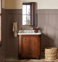 a bathroom with a sink, mirror and rug