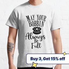 a man wearing a t - shirt that says may your bobbin always be full