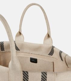 Height 35cm-14"
Max. width 62cm-24.5"
Max. depth 22cm-8.5"
Length of handles 47cm-18.5" Designer Beige Top Handle Canvas Bag, Luxury Cotton Bags With Dust Bag Included, Designer Cotton Rectangular Bag, Designer Cotton Tote Bag, Designer Cotton Tote Shoulder Bag, Designer Cotton Shopping Bags, Luxury Beige Canvas Shopping Bag, Designer Cotton Bags For Daily Use, Chic Canvas Bag With Rolled Handles