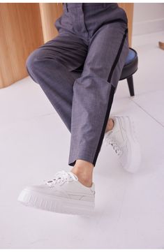 A glitter-encrusted upper and metallic trims amplify the glam appeal of a street-savvy sneaker lifted by a chunky platform sole. 1 1/2" heel; 1 1/4" platform Cushioned footbed Slip-resistant sole Leather upper/textile lining/rubber sole Imported White Platform Sneakers With Elastic Laces, Casual, White Sole Rubber Slip-on Platform Sneakers, White Low-top Platform Sneakers With Stitched Sole, White Low-top Platform Sneakers With Perforations, White Platform Sneakers With Rubber Sole, Medium Fit, Platform Sneaker, Chunky Platform, Nordstrom Rack, Womens Sneakers