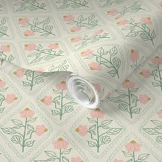 a white wallpaper with pink flowers and green leaves on the bottom half of it