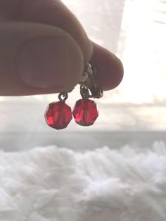 A stunning pair of red crystal dangle ball earrings, vintage 1940s or 1950s.  Fabulous condition, unmarked, one size fits all.  Costume jewelry from the 1940s or 1950s.  Just in time for Christmas or Valentines. Length:  7/8" Width crystal bead:  3/8" x 3/8" Height:  1/4" Vintage Red Clip-on Earrings For Evening, Vintage Red Drop Clip-on Earrings, Red Vintage Style Drop Clip-on Earrings, Vintage Red Clip-on Earrings As Gift, Vintage Red Jewelry For Evening, 1950s Earrings, Ball Earrings, Red Crystals, Earrings Vintage