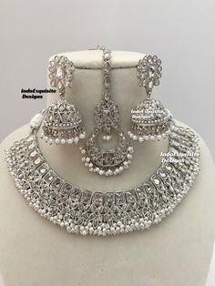 Silver color Polki Necklace Set comes with Jhumki earrings and tikka / Indian Jewelry/ High Quality Kundan and Polki Jewelry/ Bollywood Jewelry/Wedding Jewelry All items are shipped from Brampton, Ontario, Canada. If you need your item by a certain day, please reach out to us for express delivery option before placing the order so that we can update the shipping for you. Standard shipping/delivery timeline Below are the delivery timeline estimates once the order ia shipped ---> USA delivery timeline * 4-8 business days to major urban centers in USA. It may take 2-3 days extra to remote locations ---> Canada delivery timeline  * 2-3 business days - GTA  & Montreal  * 2-4  business days - Rest of Ontario/Quebec * 4-8 business days-  Rest of Canada    ---> Europe/Middle East timeline * 5-10 b Tikka Indian Jewelry, Polki Necklace Set, Brampton Ontario, Necklace Set Indian, Polki Necklace, Jhumki Earrings, Polki Jewellery, Bollywood Jewelry, Jewelry Wedding