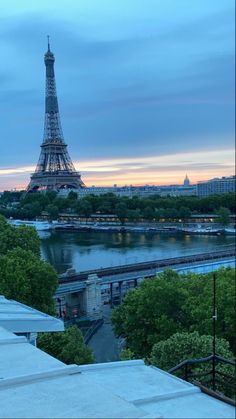 the eiffel tower towering over the city of paris, france at sunset or dawn