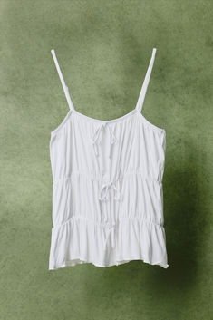 Bow Detail Top White Tie Back Camisole For Summer, White Tank Top With Wide Straps For Summer, Vacation Tank Top With Adjustable Spaghetti Straps, Summer Camisole With Adjustable Wide Straps, White Camisole With Wide Straps For Summer, Vacation Spaghetti Straps Tank Top With Adjustable Straps, White Summer Tops With Drawstring, White Summer Tops With Wide Straps, White Tops With Wide Straps For Summer