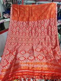 Experience the luxurious elegance of Assam silk with our handcrafted mekhela chadors. Each piece is carefully crafted using only the finest silk from the Assam region in India, known for its softness and durability. The intricate designs and traditional motifs make these mekhela chadors perfect for any special occasion, or simply as a statement piece in your wardrobe. Perfect for a modern women who want to keep her traditional roots alive. Each chador is unique and made with love, so you can be Orange Blouse Piece For Puja During Navratri, Orange Tussar Silk Traditional Wear For Diwali, Orange Silk Traditional Wear For Navratri, Semi-stitched Silk Orange Lehenga, Motif Dupatta For Rituals, Orange Silk Semi-stitched Lehenga, Ritual Motifs Dupatta, Orange Tussar Silk Traditional Drape, Orange Tussar Silk Traditional Wear