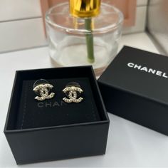 Great Preowned Condition. Approximately The Size Of A Dime. The Pearls Make This Classic And Sophisticated. Perfect Size And Goes With Everything. Gold In Color. Comes With Chanel Box Only. I Loved These, But Bought As A Birthday Gift For My Mom And She Picked A Different Chanel Pair! Reposhing This Item I Purchased From @Mleeluxe And Therefore, They Are Already Authenticated And In The Same Box. Selling Them For The Same Price I Paid For Them. Questions? Leave A Comment Below! Channel Earrings, Chanel Stud Earrings, Chanel Pouch, Chanel Jewelry Earrings, Chanel Brooch, Chanel Box, Jewelry Chanel, Plastic Earrings, Gold Chanel