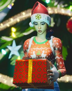 a woman holding a christmas present in front of a christmas tree