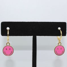 handmade, high quality smiley face huggie earrings! won't tarnish or fade! hypoallergenic  please feel free to message me! Cute Hypoallergenic Huggie Earrings, Playful Pink Hoop Earrings Gift, Pink Drop Huggie Earrings, Cute Hypoallergenic Hoop Earrings, Cute Huggie Hoop Earrings, Cute Handmade Pink Hoop Earrings, Pink Nickel-free Huggie Jewelry, Pink Playful Handmade Hoop Earrings, Playful Pink Round Earrings