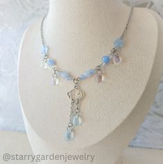 * Blue Raindrops Charm Necklace *  Made with clear and blue glass drops, soft blue glass beads and a cloud charm. * Materials: Stainless steel, glass beads and alloy charms. * Length: 44.5-47.5 cm. ➤ 𝘑𝘦𝘸𝘦𝘭𝘳𝘺 𝘊𝘢𝘳𝘦 ❀ Please handle this delicate product with care. ❀ Please avoid exposing it to water, perfumes, lotions, and harsh chemicals. ❀ Store your jewelry in a dry, clean place to prevent tarnishing and scratches. ➤ 𝘚𝘩𝘪𝘱𝘱𝘪𝘯𝘨 𝘐𝘯𝘧𝘰𝘳𝘮𝘢𝘵𝘪𝘰𝘯 ❀ Please note that sometimes Water Necklace, Cottagecore Necklace, Necklace Fairycore, Fairycore Necklace, Glass Bead Jewelry, Diy Collier, Glass Beads Jewelry, Celestial Necklace, Beaded Necklace Diy