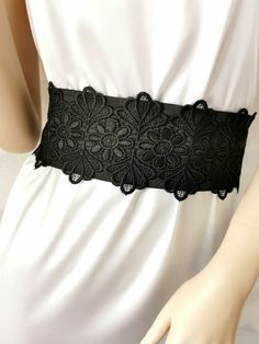 If you would like this belt in a different length or width, please, write to us. The Black wide satin belt with lace. This extra long sash is 3 inches wide and 100 inches long. The length of the lace on the belt is 20 inches. Belt material: stretch satin, lace. The satin belt is available in the following colors: 1 White 2 Ivory 3 Champagne 4 Beige 5 Peach 6 Light pink 7 Pink 8 Lilac 9 Dark pink 10 Red 11 Burgundy 12 Terracotta 13 Gray 14 Dark brown 15 Black  16 Dark green 17 Sky blue 18 Royal blue 19 Navy blue  20 Aqua blue Black Wedding Bridesmaid, Black Sash, Satin Belt, Wedding Black, Sash Belts, Bridal Belt, Sash Belt, Gothic Wedding, Belt Black