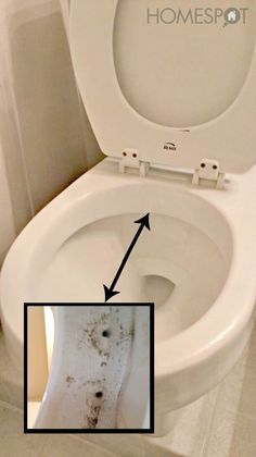 a white toilet with the seat up and two arrows pointing to it's left side