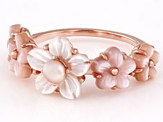 a close up of a ring with flowers on it