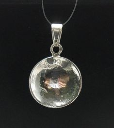 STERLING SILVER PENDANT. ,APPROXIMATE WEIGHT 2.6 GRAMS,, DIAMETER 1.9CM . All our jewels are made from solid sterling silver 925/1000 and are carefully crafted by hand in our family workshop.We dispatch your orders in 5 working days, worldwide and the postage is $5. We ship registered priority mail. Please allow 5-7 working days for delivery in Europe and 10-15 working days outside Europe.For any questions – please do not hesitate to contact me! Silver Hammered Pendant Jewelry, Hammered Sterling Silver Round Pendant, Hammered Sterling Silver Round Pendant Jewelry, Sterling Silver Coin Pendant Jewelry, Silver Jewelry With Large Round Disc Pendant, Sterling Silver Jewelry With Polished Round Disc, Sterling Silver Round Disc Jewelry With Polished Finish, Spiritual Sterling Silver Round Disc Jewelry, Sterling Silver Shiny Jewelry