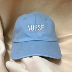 This Nurse hat is the perfect gift to new nurses, current nurses, or aspiring nurses you know such as yourself and your loved ones! Match with your friends and co-workers! - Embroidered Texts - Adjustable back - Unisex fit, so it fits all! Thank you so much for supporting our small business! Nurse Week Gifts, Message Thread, Nurse Week, Nurses Week Gifts, Nursing Accessories, Nursing Student Gifts, Nurse Appreciation Gifts, New Nurse, Nurse Hat