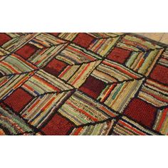 an area rug with different colored squares on it