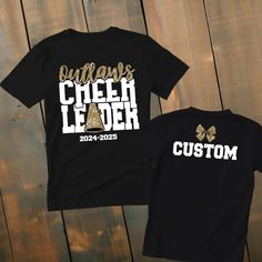 Custom Glitter Cheerleader Shirt *This custom shirt is handmade with professional vinyl. *Our shirts are unisex and are true to size! *In the photo's you will be able to see the custom options in regards to color that you may choose from. *We use 100% cotton shirts. The glitter material does not wash off and will last through multiple washes.  *If your shirt color is out of stock we will contact you as soon as possible to see if you would like to change shirt colors. By purchasing from us you agree to the following statements: *Due to the custom nature of this item we do not accept exchanges or refunds. *We are also not responsible for lost packages. Please contact your local post office for lost package information. Customizable Black Top For Cheerleading, Customizable Black Tops For Cheerleading, Black Glitter T-shirt With Short Sleeves, Black Glitter Short Sleeve T-shirt, School Spirit Glitter Print Crew Neck T-shirt, Customizable Short Sleeve Tops For Cheerleading, School Spirit Glitter Print Short Sleeve Top, School Spirit Short Sleeve Top With Glitter Print, Short Sleeve Tops With Glitter Print For School Spirit