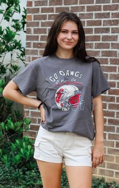 Rock ‘Em Dawgs! Nothing better than your favorite team's tee mixed with a vintage concert tee... and our Helmet Lick Thrifted Tee is just that! UGA Bulldogs meets The Rolling Stones with our oversized, slightly distressed tee in a vintage style graphic. Perfect for a cute, yet comfy look our thrifted tees pairs perfectly with biker shorts, jean shorts, or a pair of leggings and your favorite sneakers. Details: *OFFICIALLY LICENSED* Slightly Oversized Fit Vintage looking graphic Distressed detail Thrifted Tees, Uga Bulldogs, Tallahassee Florida, Distressed Tee, University Of Georgia, Gifts For My Wife, Concert Tees, Trendy Clothing, Georgia Bulldogs