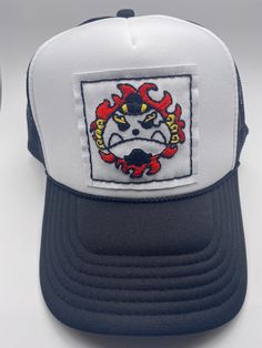 a white and blue trucker hat with a red crab on it's front