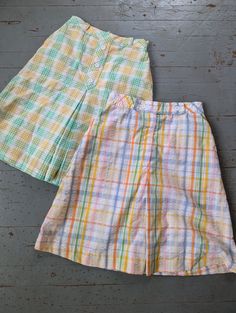 Active and on the go insm style with breathable cotton and built in shorts! Wide enough to look like a skirt. I. Excellent condition. High waisted a line silhouette. Functional pockets. Zipper back. 11 inches across the waist, 16 inches across the hips and 21 inches long. Summer Cotton Skort With Built-in Shorts, Gingham Cotton Shorts For Daywear, Cotton Skirt With Built-in Shorts, Plaid Pleated Skort For Summer, Summer Plaid Pleated Skort, Summer Pleated Plaid Skort, Summer School Skirt Bottoms, School Skirt For Summer, Retro Cotton Pleated Skort