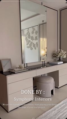 a large mirror sitting on top of a dresser