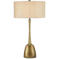 a gold table lamp with a beige shade on it's base and a white linen lampshade