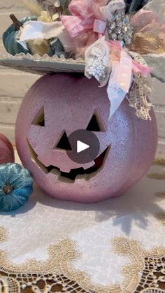 a purple pumpkin sitting on top of a table