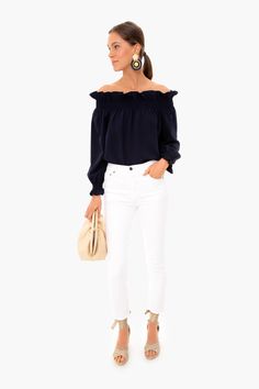 A little bit of shoulder adds a flirty touch, making the Marguerite the perfect date night look. Featuring a standing ruffle neckline and smocked cuffs, this is everything we look for in a going out top; bold, unique and slightly sassy. Pair with white denim and espadrilles for a truly chic outfit.

Off-the-shoulder
Elastic cuff and shoulder
Ruffle detailing
100% polyester
Care: Machine wash cold Spring Ruffled Off-shoulder Top For Night Out, Spring Off-shoulder Top With Ruffles For Night Out, Off-shoulder Ruffle Top For Date Night, Chic Off-shoulder Blouse For Brunch, Chic Ruffled Off-shoulder Top For Day Out, Chic Ruffle Hem Blouse For Night Out, Chic Off-shoulder Top For Day Out, Chic Smocked Top With Smocked Cuffs For Work, Chic Spring Off-shoulder Top With Blouson Sleeves