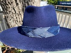 Designer choice!! Take a look at this fun denim blue adjustable hatband with different colors of denim that really make this hatband pop on any style/color of hat. The band is 22.5" x 1.25" and has adjustable navy-blue suede ties in the back so it can fit hats from 22.5-34". The band is secured by two gold tie clamps in the back to give it a nice, finished look. The hat band has been sewn together and treated with fray protector to help keep this hatband looking good for years to come. To comple Blue Adjustable Felt Hat With Short Brim, Blue Wide Brim Adjustable Fedora, Adjustable Blue Felt Hat With Curved Brim, Adjustable Wide Brim Blue Felt Hat, Adjustable Blue Wide Brim Felt Hat, Blue Fedora With Flat Brim, One Size Fits Most, Casual Adjustable Blue Felt Hat, Blue Flat Brim Fedora One Size Fits Most, Blue Fedora With Flat Brim