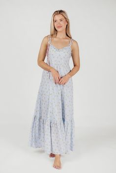 Simple but absolutely charming, the Penelope Maxi Dress is just the ticket for your next summer event. From its delicate ruffled details to its in-seam pockets and flounced skirt, the Penelope is all cottagecore elegance. Dressed up with heels or dressed down with slides or mules, this dress promises season after season of beautiful wear. Available in two colorways. FIT: Runs true to size. MATERIAL: Cotton. GARMENT DETAILS: Lightweight floral maxi dress with V-neckline, ruffled double straps, and a cinched waist. Features full skirt with ruffled hem, dual in-seam pockets, and a smocked back panel. SIZE GUIDE: XS (0-2) / S (2-4) / M (6-8) / L (10-12) / XL (14-16) MODEL DETAILS: MISSES Mackenzie - Size S Heather - Size S Bust 34" 34" Waist 27.5" 27.5" Hips 40.5" 37.5" Height 5'7" 5'7" Spring Ruffle Dress For Garden Party With Smocked Bodice, Summer Tiered Ruffle Dress For Garden Party, Summer Garden Party Ruffle Dress With Smocked Bodice, Summer Maxi Dress With Ruffled Straps, Flowy Ruffled Sundress For Garden Party, Flowing Ruffle Dress With Ruffled Straps For Garden Party, Flowy Ruffle Dress With Ruffled Straps For Garden Party, Spring Dresses With Ruffled Straps For Daywear, Summer Maxi Dress With Ruffled Straps For Daywear