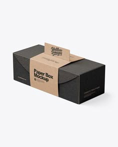 a black cardboard box with a brown paper mockup on the front and bottom side