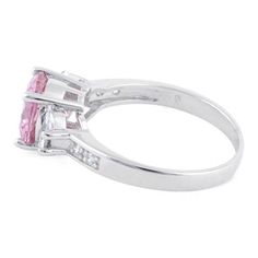 Top of ring height: 8mm

         Top of ring width: 16mm

      Shank width: 2.5mm

    
        Stone material:  pink & clear cubic zirconia

      Center stone size: 9mm  

      Stone shape:  round (center) & half round

      Center stone carat    weight: 2.8 ct.

      Total number of CZ    stones: 6

      Stone setting:  basket prong setting

   
       Metal:  925 sterling silver

      Plating:  rhodium plated    (what is rhodium?) What is Rhodium? 
 
   If Pink Engagement Ring, Stone Material, Stone Setting, Cz Ring, Cz Stone, Stone Settings, Rhodium Plated, Prong Setting, Cubic Zirconia