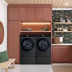 a washer and dryer in a room with wallpaper on the walls behind them