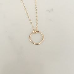 Your favorite new everyday necklace. The Full Circle necklace features a lightly hammered sterling silver or 14k gold fill circle suspended on an adjustable drop chain adored with delicate heart charm. Everyday Hypoallergenic 14k Gold Charm Necklace, Adjustable Circle Necklaces For Everyday, Everyday Adjustable Circular Necklaces, Everyday Yellow Gold Circle Charm Necklace, Adjustable Simple Everyday Necklace, Everyday Charm Necklace With Round Pendant And Delicate Chain, Everyday Hypoallergenic Round Pendant Necklaces, Everyday Circle Charm Necklaces With Adjustable Chain, Minimalist 14k Gold Filled Round Disc Necklaces