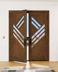 an open wooden door with glass panels on the inside and outside doors, in front of a white wall