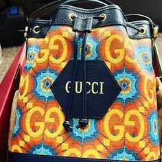 During Its 100 Years, Gucci Has Established Itself As One Of The Most Influential Fashion Houses. In Honor Of The Centennial, This Ophidia Bucket Bag Celebrates The House's Whimsical Nature With A Colorful Print That Mixes Circles And Ggs To Create A Playful Kaleidoscope Effect. A Leather Detail With The Gucci Script Logo Completes The Style. Designer Yellow Gucci Bag, Yellow Designer Gucci Bag, Gucci Multicolor Bag For Everyday Use, Multicolor Gucci Shopping Bag, Multicolor Gucci Bags, Designer Yellow Pouch Bag, Gucci Multicolor Bags For Daily Use, Designer Yellow Bucket Bag, Daily Use Multicolor Gucci Bags