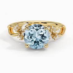 an oval blue topazte and diamond ring