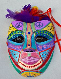 Mask - Full face masquerade mask - Mardi Gras Mask - Full face Mask of Symbols. One of a kind, paper mache mask is hand-painted with various symbols including peace sign, music notes, and staff, hearts, stars, and sunburst. Mask design is accented with jewels. Mask is topped with a crown of feathers. Mask is lined and ties on with 18 inch satin ribbons. Great for Masquerade and Mardi Gras. Fits most. designAnn Original Mask See more at http://www.designAnn.etsy.com Artistic Hand-painted Masks For Carnival, Artistic Hand Painted Masks For Carnival, Artistic Masquerade Mask For Mardi Gras, Artistic Hand Painted Masks And Prosthetics For Carnival, Artistic Eye Mask For Festivals, Artistic Masks For Carnival And Art Events, Artistic Masks And Prosthetics For Mardi Gras, Artistic Masquerade Mask For Festivals, Mardi Gras Festival Eye Mask