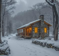 a small cabin in the middle of a snowy forest