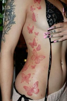 a woman with butterfly tattoos on her body