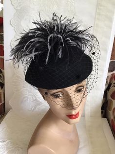 "Vintage 1970's dark Black Wool Felt hat. Has veiling with Black and White feathers. Label is *Miss Bierner*. Made in USA. *MORE INFORMATION BELOW* CONDITION: No issues noted. MEASURES: Inside circumference~21\" Front to back~7\" Left to right~8\" *WE APOLOGIZE~BUT WE NO LONGER SHIP TO GERMANY, ITALY OR SPAIN. IF ORDERS COME IN FROM GERMANY, ITALY OR SPAIN, WE WILL HAVE TO CANCEL THEM AND REFUND YOUR MONEY. SORRY FOR THIS INCONVENIENCE*" Vintage Black Wide Brim Costume Hat, Black Brimmed Hat For Vintage Events, Vintage Black Cloche Hat For Evening, Black Brimmed Fall Costume Hat, Black Brimmed Costume Hat For Fall, Brimmed Black Costume Hat For Fall, Vintage Black Top Hat For Church, Vintage Black Hat For Evening, Vintage Black Cloche Hat With Wide Brim