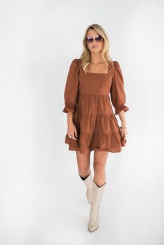 Have you ever seen a more perfect outdoor concert, drinks with friends, brunch, work, happy hour dress? Our Willow dress is the dress for every occasion. We love it paired with western boots for the perfect casual chic vibe. Grab her before she is gone. Features: Square neckline Zip Closure 3/4 sleeve with detail Square back Small : bust 30” length 32” Medium : bust 32” length 33” Large : bust 34" length 33.5" Model is wearing a medium. Height 5'8", Bust 35", Waist 28.5", Hip 34.5" Fabric conten Chic Brown Dress With Square Neckline, Chic Brown Square Neck Dress, Spring Workwear Mini Dress With Square Neck, Square Neck Mini Dress For Spring Workwear, Fall Ruffle Dress With 3/4 Sleeves, Fall Dresses With Ruffles And 3/4 Sleeves, Fall Midi Dress With Ruffle Hem For Brunch, Square Neck Dresses For Dress Down Days In Fall, Fall Midi Dress For Brunch, Knee-length