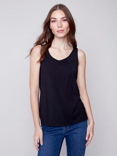 Description Stock up on this versatile tank top for women – it’s reversible, meaning you can wear it with the front scoop neckline, or the other side’s V neckline. New day, new shirt! Available in all the must-have neutrals. Go back to basics in this Black camisole for women. Front crew neck, back V neckline Reversible women’s top Relaxed fit Why we love it Made from the cellulose of bamboo, you’ll love the silky, soft feel of this women’s camisole. It’s the perfect layering tank top, and it’s e Everyday V-neck Top With Built-in Bra, V-neck Top With Built-in Bra For Everyday, Everyday Scoop Neck Top With Built-in Bra, Versatile Everyday Cami Top, Versatile Tank Top, Everyday Versatile Camisole, Versatile Everyday Camisole, Versatile Camisole Tank Top For Layering, Versatile Sleeveless Blouse For Everyday