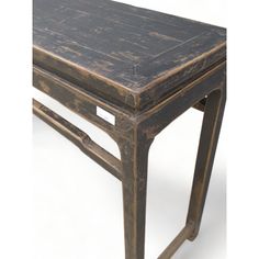 an old wooden table with metal legs and a tag on the top that says,